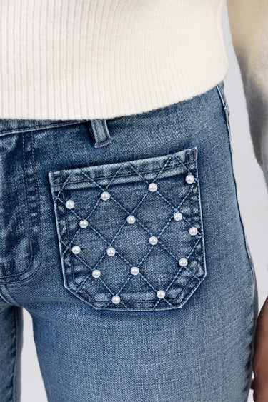 blue denim jeans back pocket with diamond quilt stitching and pearl studs