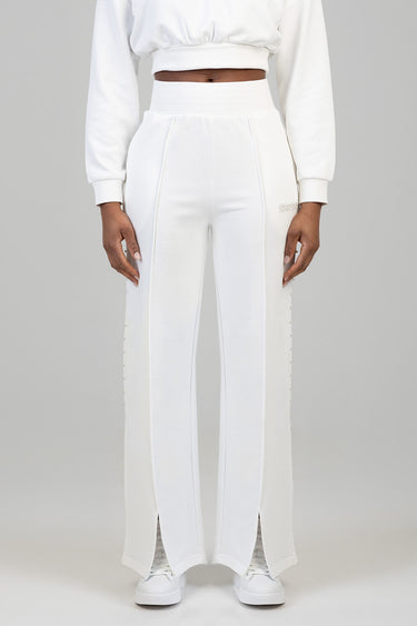 Blue Jean Traders white high waist wide leg pants with pearl side detailing worn with a white cropped sweatshirt