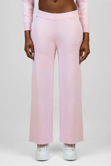pink gradient knit pants by Blue Jean Traders with wide legs and a small embroidered logo on the left hip