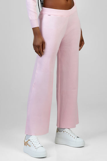 pink knit wide leg pants worn by a model with white sneakers