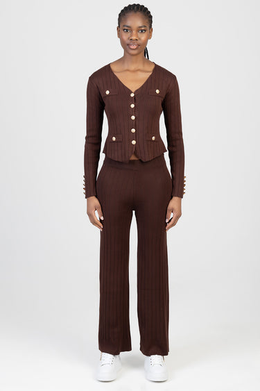 woman in a brown ribbed knit cardigan with gold buttons and matching wide leg pants