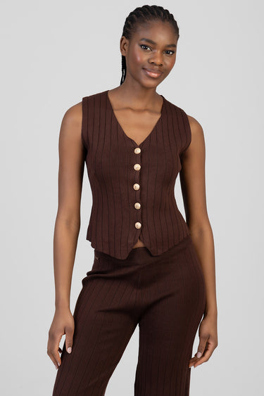 brown ribbed knit waistcoat with gold buttons, sleeveless v neck, with matching ribbed trousers on a model
