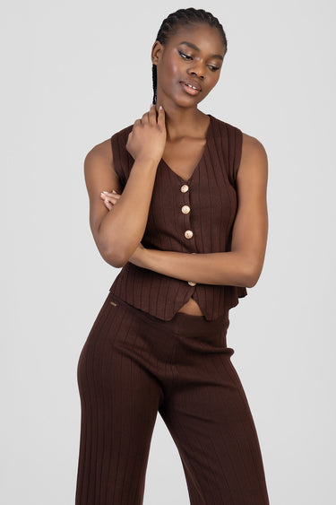 woman in chocolate brown knit waistcoat with vertical ribs and gold buttons, matching knit trousers by Blue Jean Traders