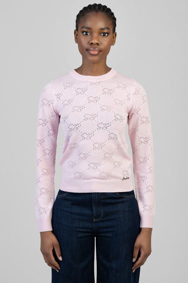 pink knit top with long sleeves and a delicate bow pattern all over