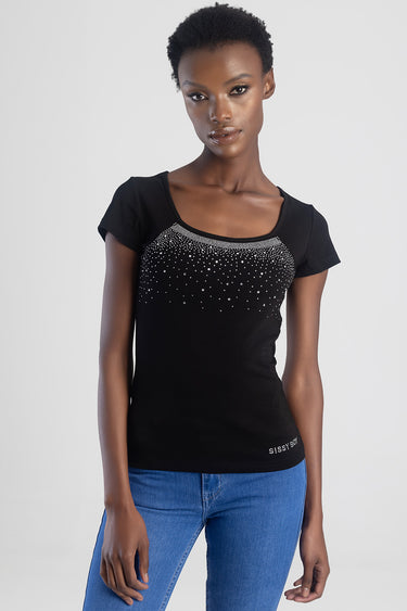 woman wearing a black short sleeve knit top with a scoop neckline and silver rhinestones across the chest