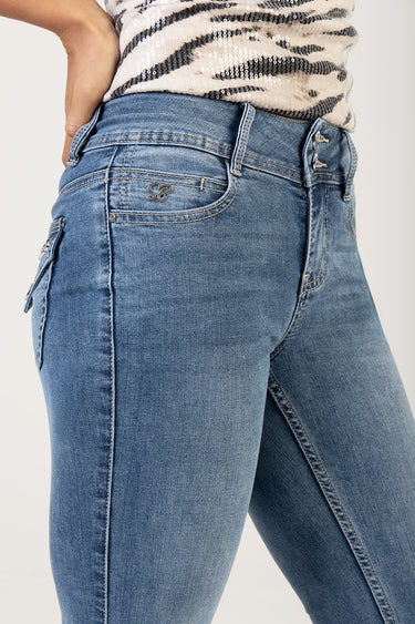 blue denim jeans with light wash, belt loops and a small metal logo on the coin pocket at the hip