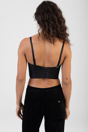 back view of a black corset style top with adjustable straps and a multi hook closure