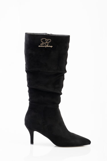 Blue Jean Traders black suede knee high boot with a slouched shaft and pointed toe, gold logo at the top.