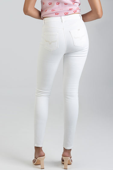 rear view of white skinny jeans by Blue Jean Traders on a model, back pockets with stitched details