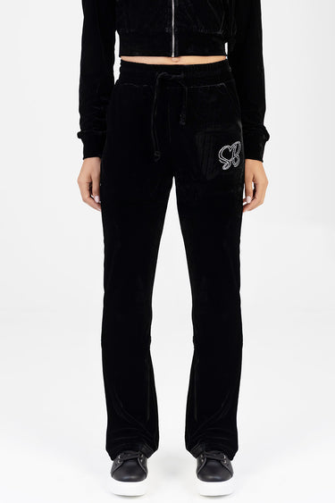 Blue Jean Traders black velvet track pants with drawstring waist and rhinestone butterfly on left thigh