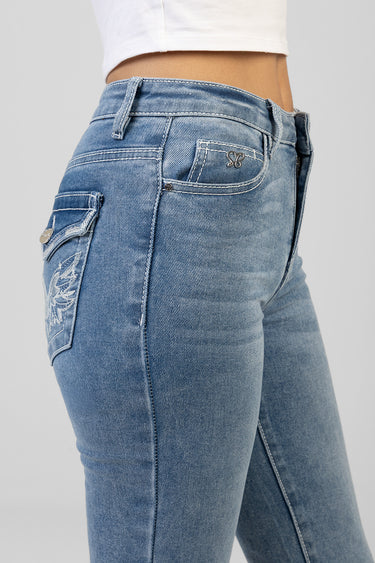 side view of light blue denim jeans with faded wash, belt loops and a decorative stitched cargo pocket