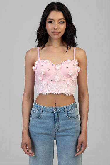 pink floral corset style crop top with lace hem and rhinestone accents, worn with blue jeans by blue jean traders