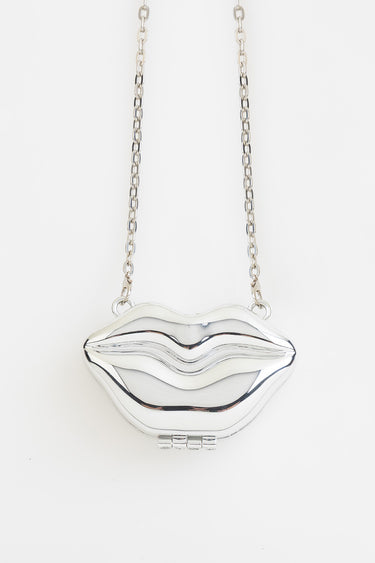 silver lip shaped handbag with chain strap pendant