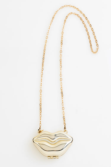 Blue Jean Traders lip shaped pendant on a delicate gold chain necklace