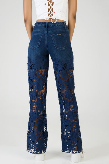 back view of dark blue wide leg jeans with floral lace panels from mid thigh to hem and two back pockets