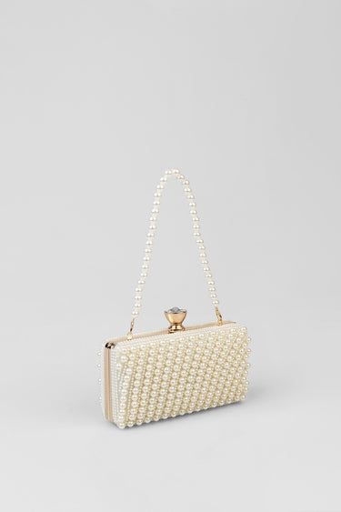 pearl beaded clutch bag by Blue Jean Traders with a gold tone clasp and a pearl handle