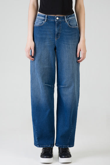 blue balloon leg jeans with a high waist, faded front, five pocket styling and contrast stitching worn by a model