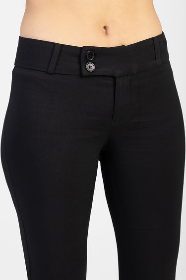 black bootleg trousers with two buttons and belt loops on a model