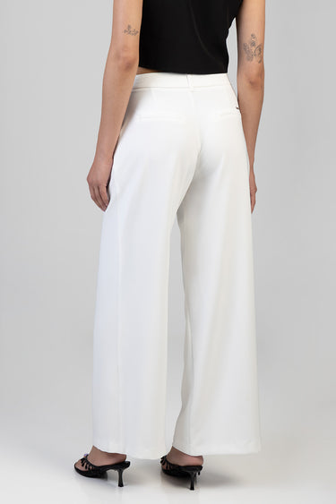 white wide leg trousers on a model back view with two welt pockets and a slim waistband