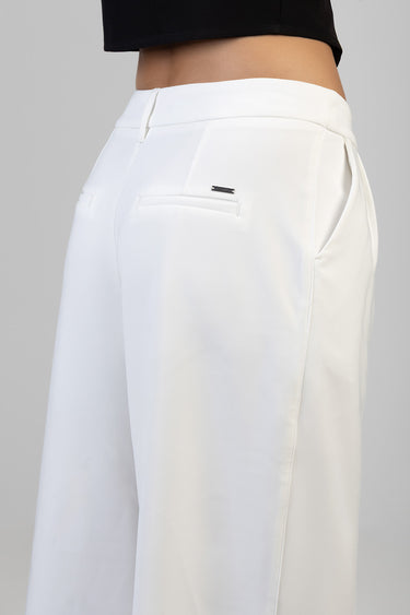 white wide leg trousers with a tied waist, belt loops, and a back welt pocket with a small metal badge