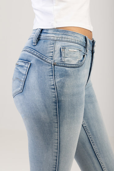 blue jean traders light wash skinny jeans shown from the side with belt loops and back pocket featuring a small logo tag