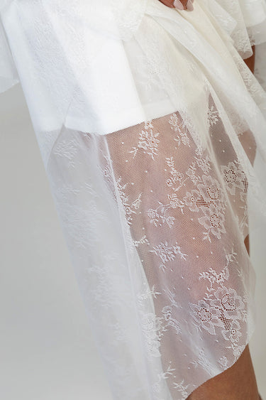 white lace skirt with sheer floral overlay and visible underlayer