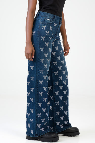 blue jean traders wide leg jeans with an all over white bow pattern and five pocket styling