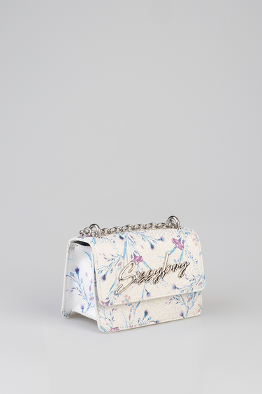 cream colored handbag with blue and pink floral print and a silver chain strap