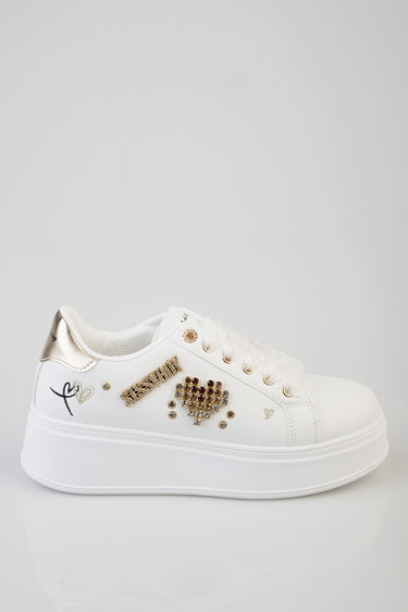 blue jean traders white platform sneakers with gold heel patch and crystal embellishments