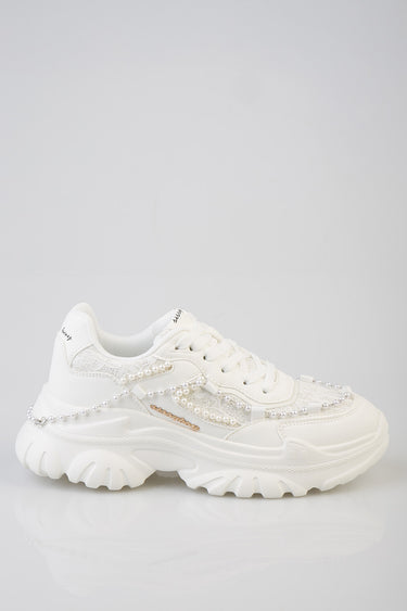 white sneakers with pearl bead embellishments and a decorative chain along the side, chunky sole