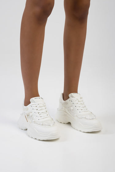 Blue Jean Traders white chunky sneakers with pearl bead detailing on feet