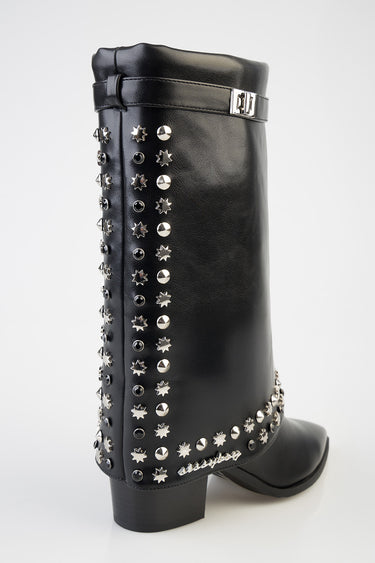 black leather knee high boot with silver studs and a buckle strap at the top and a low block heel