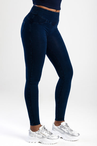 Blue Jean Traders dark indigo high waist denim jeans with pockets, paired with white chunky sneakers