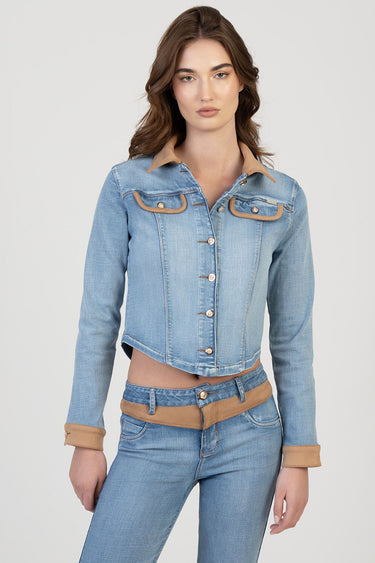 woman in light blue denim jacket with tan collar and cuffs, button front and chest pockets with tan trim, paired with jeans