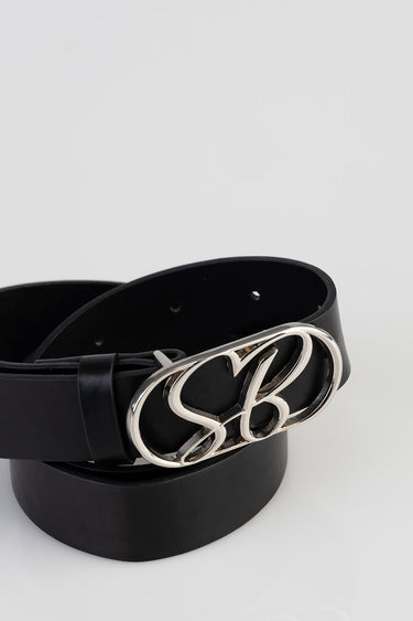 black leather belt with a large silver buckle featuring intertwined letters