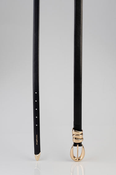 black leather belt with three stacked gold loops near the buckle and a gold end tip on a light background