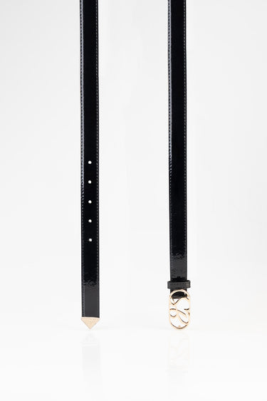 two black patent leather belts with a gold buckle and pointed end on white background