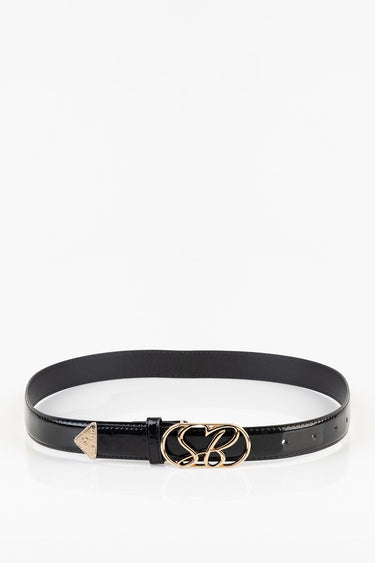 black patent belt with a gold interlocking buckle and a small gold tip, laid flat on a white background