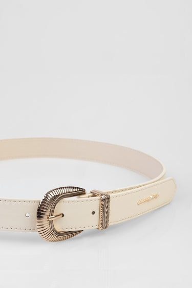 beige leather belt with a gold toned ornate buckle and stitched edges along the strap