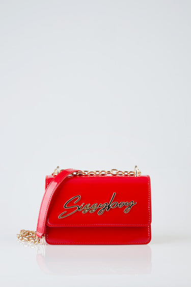 red crossbody bag with gold chain strap and cursive logo on front