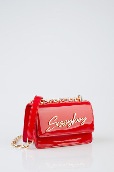 red patent leather crossbody bag with a gold chain strap and cursive logo on the front