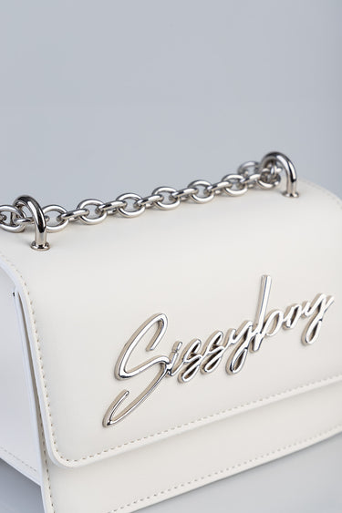 white crossbody bag with a silver chain strap and a metallic cursive logo on the front