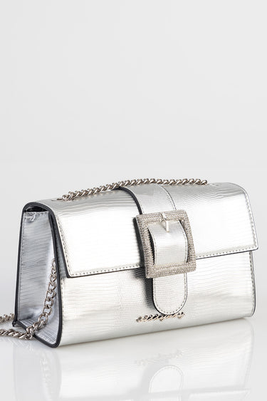metallic silver handbag with a chain shoulder strap and a glittery square buckle closure