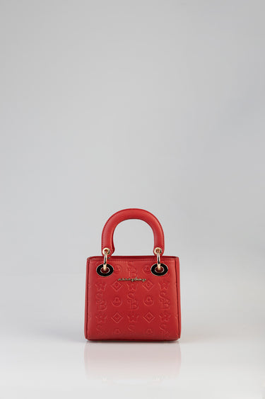 red debossed tote bag with rounded top handles, gold hardware, and an all over embossed pattern by blue jean traders