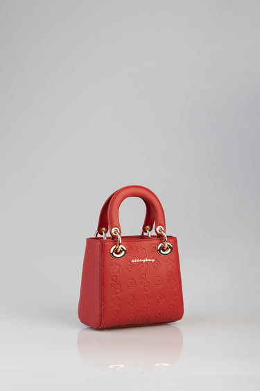 red debossed tote bag by blue jean traders with gold hardware and rounded top handles