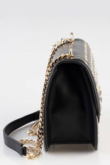 black leather crossbody bag with a gold chain strap and visible stitching along the top edge