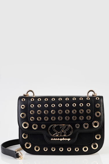 black leather crossbody bag with gold ring grommets and a decorative logo emblem