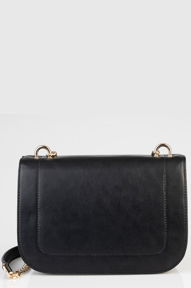 black leather crossbody bag with gold metal rings and a short chain strap