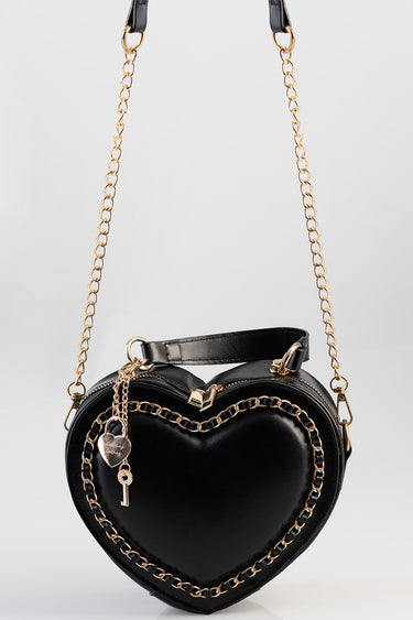black heart shaped crossbody bag with gold chain accents and a small key charm