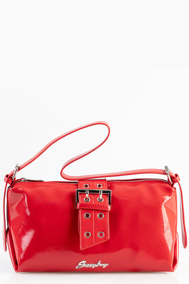 red patent leather shoulder bag with buckle detail and silver hardware, long strap slung over top edge